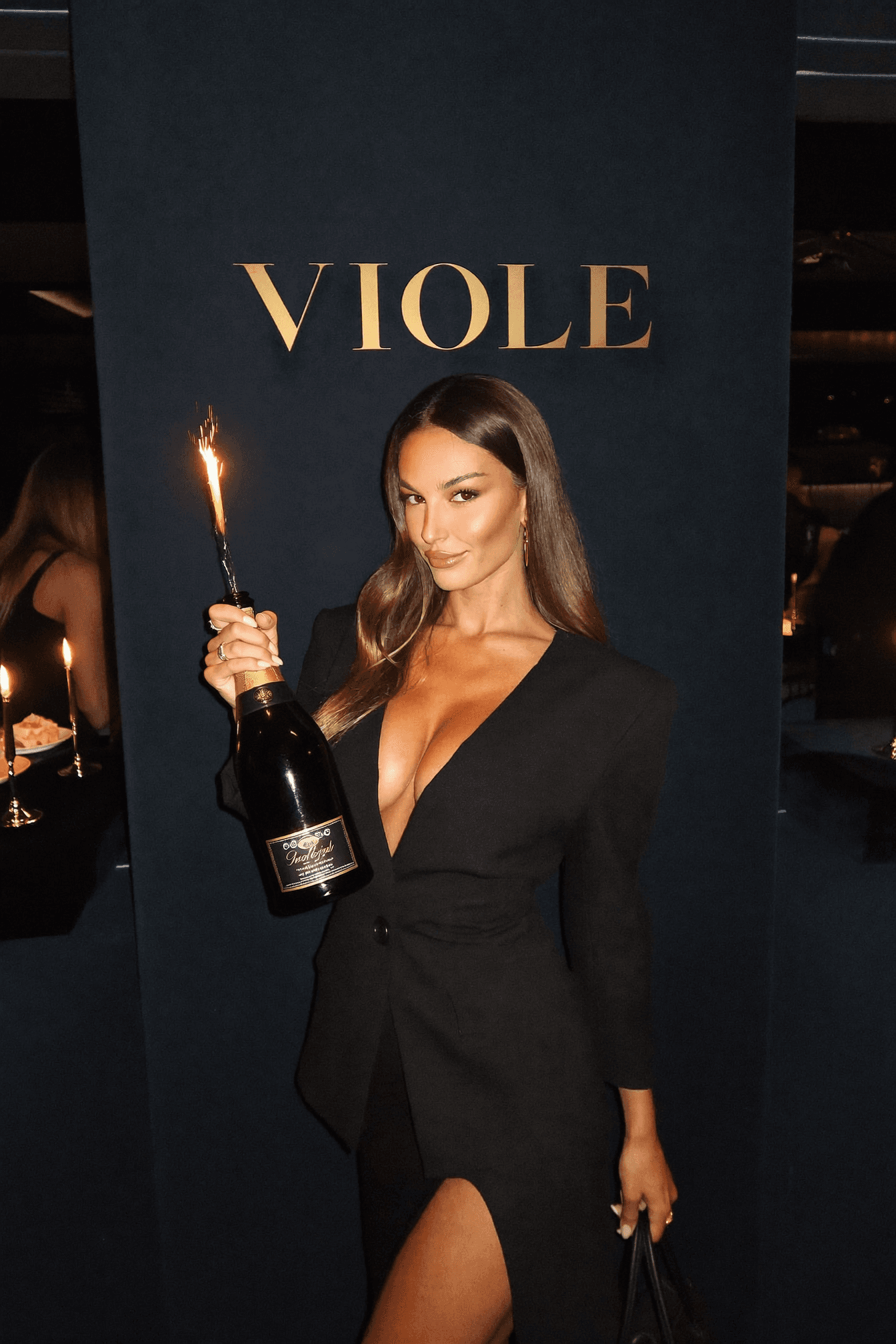NYX bottle service — bottle girl presenting champagne with sparklers